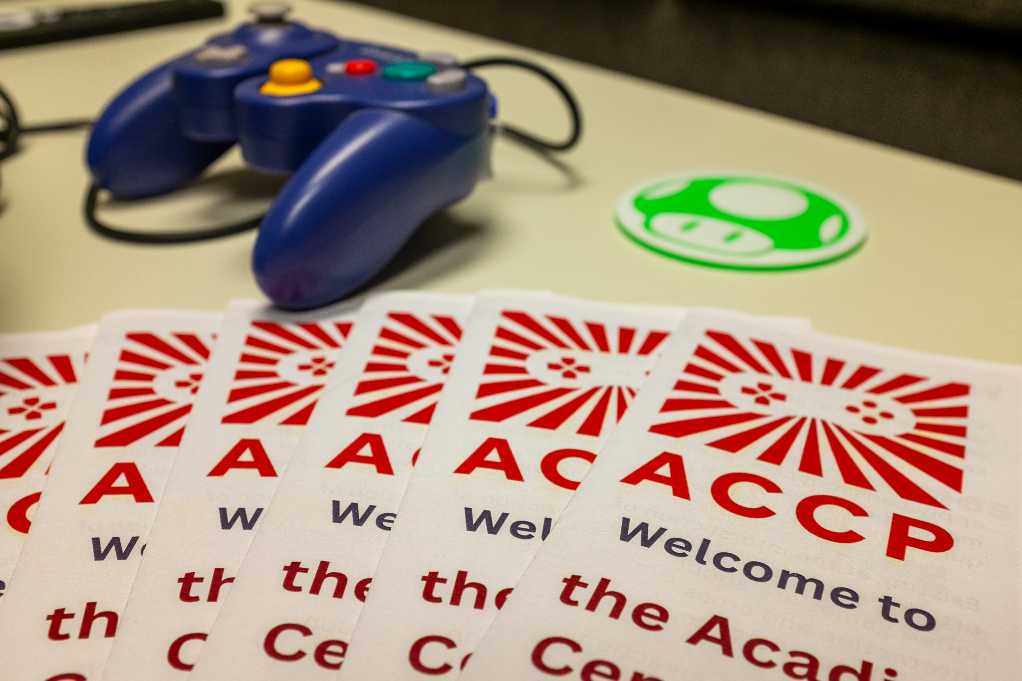 some pamphlets and a game controller